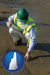 new-hampshire an environmental engineer wearing a green safety helmet