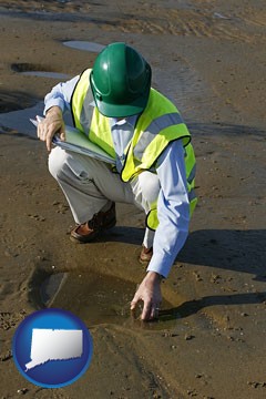 an environmental engineer wearing a green safety helmet - with Connecticut icon