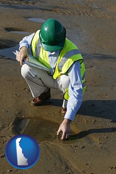 an environmental engineer wearing a green safety helmet - with Delaware icon