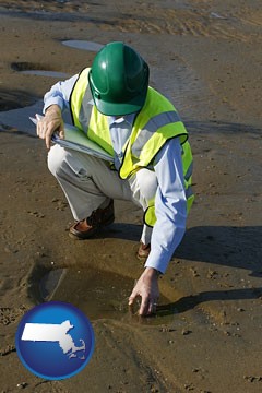 an environmental engineer wearing a green safety helmet - with Massachusetts icon