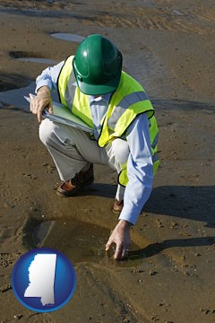 an environmental engineer wearing a green safety helmet - with Mississippi icon