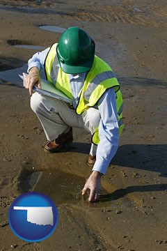 an environmental engineer wearing a green safety helmet - with Oklahoma icon