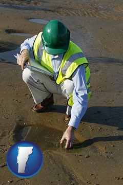 an environmental engineer wearing a green safety helmet - with Vermont icon